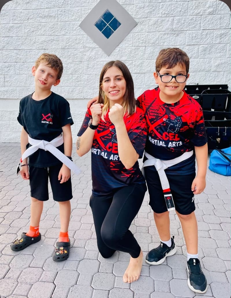 Martial arts instructor Maria with young students outdoors in Boca Raton